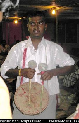 [Suva Wedding  Drummer using traditional instrument  playing at great speed]