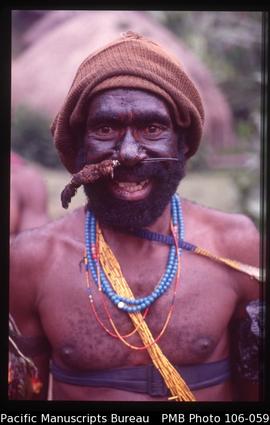 [Dani man near Baliem Valley, with (probably) cassowary bone through nasal septum, yellow orchid ...
