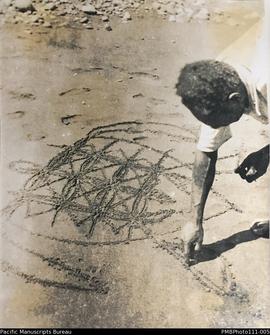 'Aisulmbati makes a one line drawing.' Sand drawing, Malekula