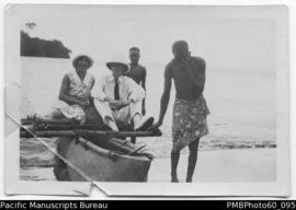 Mr and Mrs Paton on outrigger canoe with two ni-Vanuatu men