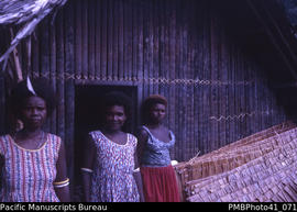 [Three women] 'Near Kolosulu, Guadalcanal'