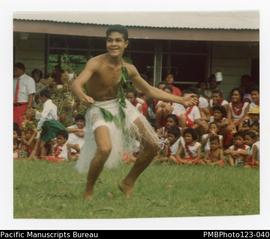 Dancing child at the district Methodist Sunday School marching competition. Gataivai, Savaii