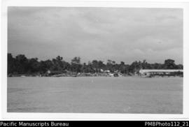 Madang [Madang District, buildings on coastline, possibly wharves]