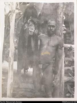 'Chief's son holds embalmed head of late chief.' Mindu, Malekula