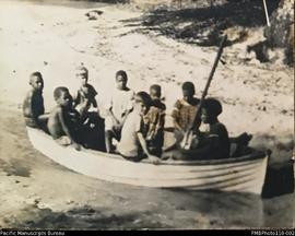 Group in small rowing boat, Aulua, Malekula