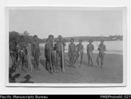ni-Vanuatu men with their fishing spears at Santo Beach