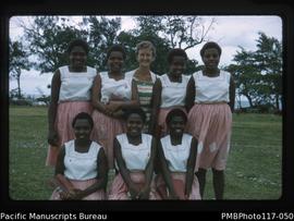 ‘Lyn Walker with South West Bay girls at OHS’ [Onesua High School]