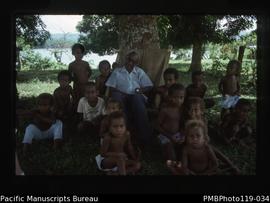 'Chief Moli Rano [?] and children under mango tree on Tangoa'