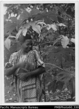 ni-Vanuatu woman holding a book