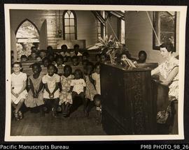 Sunday school class, Vila Presbyterian Church. Mrs Owen at the organ