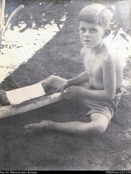 'Fofo', Donovan (Fofo) Stallan, 7 years old, with model canoe