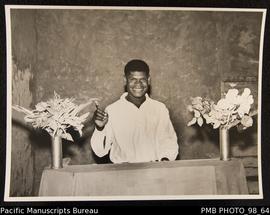 Ni-Vanuatu man with church flower arrangements