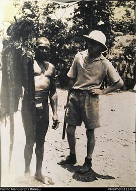 'Note the mbuti', Chiefs son holding embalmed head of late chief, Mindua, Malekula