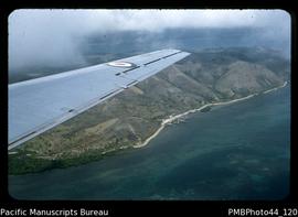 "South-eastern coast of Papua (coral, small village, coastal road, peninsula)"