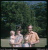 "Judy and Cliff Smith (doctor) with Malcom and Stephen, in their garden at Baiyer River."