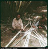"Flattening out the bamboo with a hammer, on a flat stone - preparing for weaving "pit ...