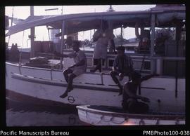 "Inter-island boat and crew, Honiara wharf"