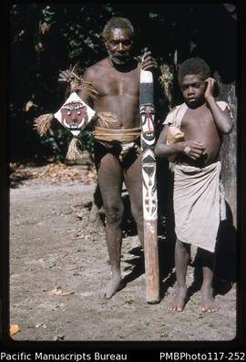 ‘Toman Island. Old Tom and his picaninny with pig killing stick and "charm" for a bow. ...