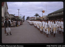 'Boys' school band with new Post Office and Burns Philp store behind, Tonga'