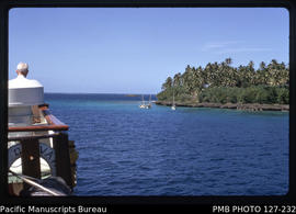 'Three sailing cutters anchored off island near Ha'afeva Island waiting for MV Olovaha, Tonga'