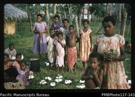 ‘People from Lembinuen village spread out rice and meat ready to eat on cotton tree leaves. Vembu...