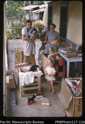 'Taylor family unpacking mission boxes'
