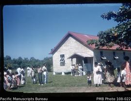 Village congregation outside church