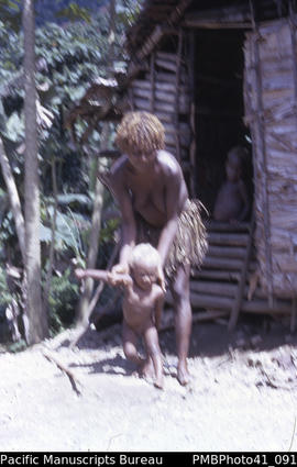 [Woman and child] ‘Bush hamlet – Simiu, Guadalcanal'