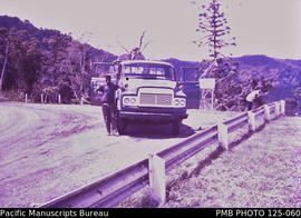'Highlands Highway: Toyota truck with back cargo of empty drums from Highlands to port of Lae'