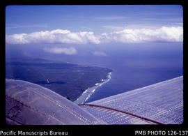 'Aerial view looking southeastwards over Fahefa village towards Houma, Tonga'