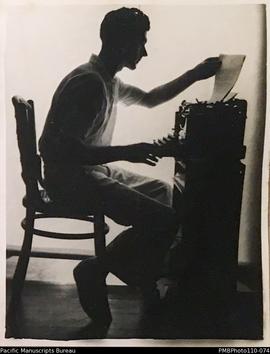 'Characteristic poses', missionary at desk with typewriter, possibly E.O. Cox