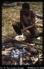 Simon cooking witchetty grubs, Strickland camp