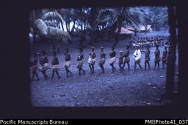 '[Women and children] Carrying yams, Moro Movement, Weather Coast, Guadalcanal'