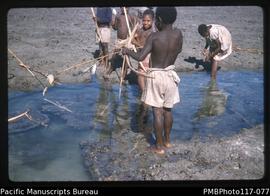 ‘Children with bows and arrows get poisoned fish. Witawa, South West Bay.’