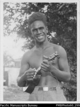 Cheerful young man strumming ukulele