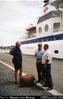 Bill Gammage and David Gowty talking to security person before boarding Clipper Odyssey.  Baie de...