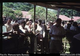 "Women buying stuff at church bazaar, Honiara"