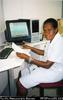 Nurse Mendie Polo ? entering data in Heduru Clinic Port Moresby General Hospital
