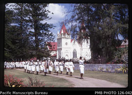'Tonga Police Force Band and Royal Guards, with Royal Chapel behind, Tonga'