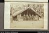 Three men, one woman and two chidren in front of small canoe house [Uji]