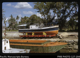 'MV Fukave on the slipway in Faua Harbour, with steel barge in foreground, Tonga'