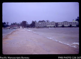 'View of Dateline Hotel from nearby Yellow Pier during cyclone, Tonga'