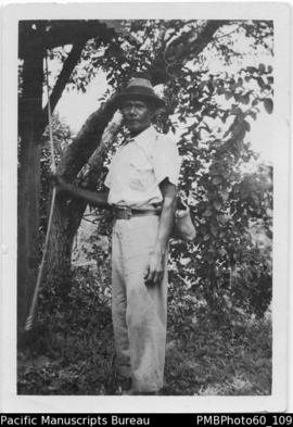 ni-Vanuatu man dressed in hat, shirt and long trousers
