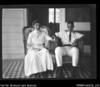 Woodford and his wife relaxing on the verandah. Very blurry negative.
