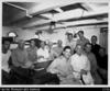 Group of men inside cabin of ship Tiare Tapora)