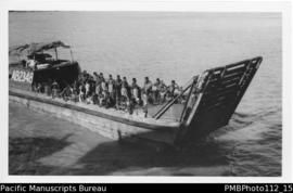 Lae [Morobe District;  landing barge AB2348 European driver, many men, probably employees]