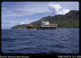 'MV Komaiwai up on the reef at Munia Island as seen from a distance, Fiji'