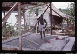 'Aaron, the PWD carpenter, with the completed reinforced concrete foundation, Sikile, Roviana Lag...