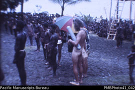 'Canadian TV camera crew in traditional Guadalcanal dress, Moro Movement, Weather Coast, Guadalca...