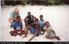 Bill Gammage on beach in front of White Beach Bungalows with locals (South Tanna)